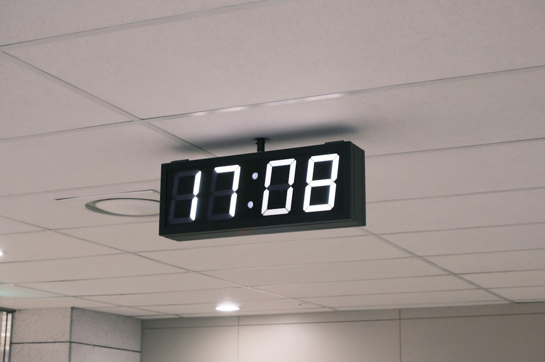 Digital queue ticket screen in an office lobby